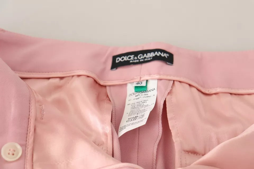 Pantalons en laine rose Dolce & Gabbana, taille moyenne, coupe tapered, vue de face avec détails de couture.