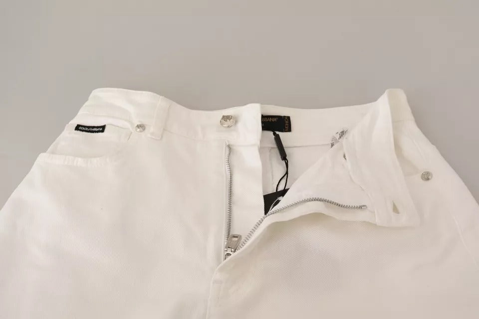 Jeans en denim blanc Dolce & Gabbana MONICA, coupe boot cut, mode élégante, visible détails du tissu et de la coupe.