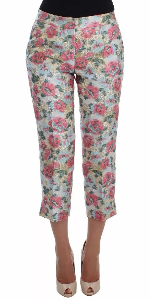 Pantalons en brocart blanc et rose avec motif floral Dolce & Gabbana, style élégant et sophistiqué.