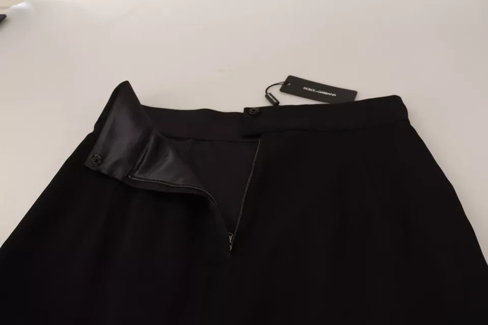 Jupe courte en soie noire à taille haute de Dolce & Gabbana, coupe pencil ajustée et élégante, pour un style sophistiqué.