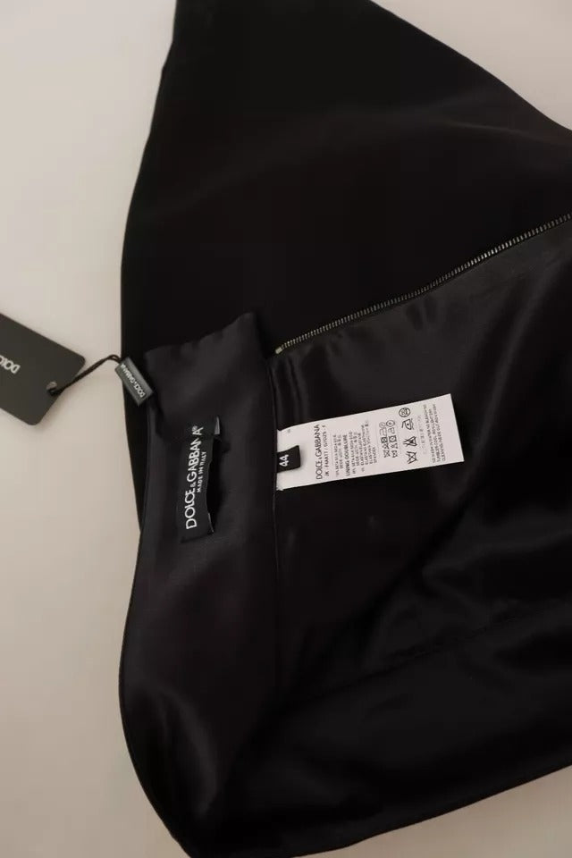Jupe courte en soie noire de Dolce & Gabbana, coupe pince haute taille, tissu élégant et sophistiqué.