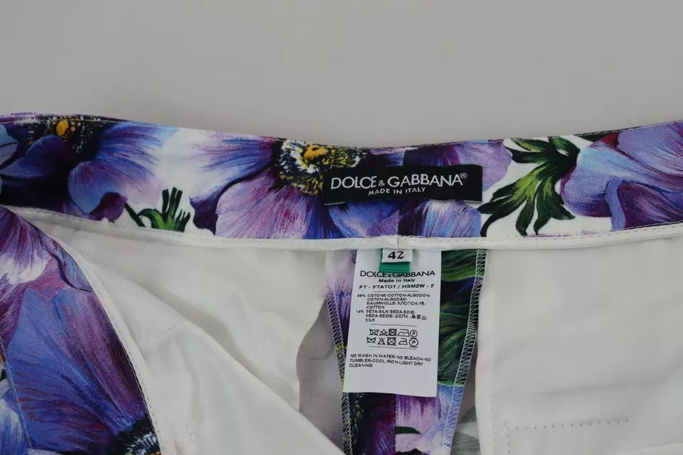 Pantalon en coton violet à imprimé floral de coupe tapered de Dolce & Gabbana, visible avec détails de tissu et design élégant.