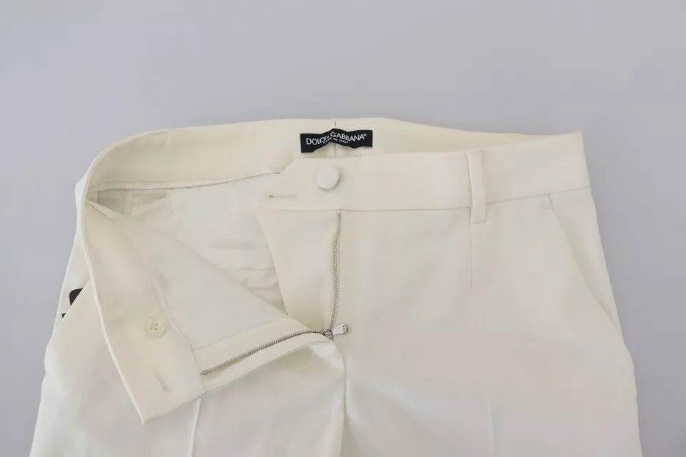 Pantalon en laine blanche à taille haute et coupe tapered de Dolce & Gabbana, vue de face, détails élégants et couture soignée.