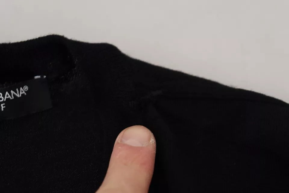 Pull à manches longues noir Dolce & Gabbana, col rond, en laine douce, style élégant et classique.