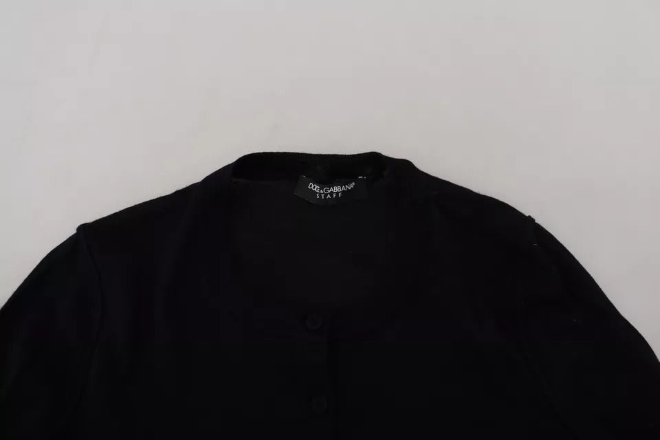 Pull noir Dolce & Gabbana à col rond et manches longues, vue de face, en tissu doux et élégant.