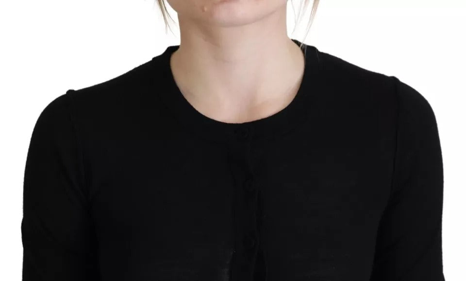 Pull à manches longues Dolce & Gabbana noir à col rond, vêtement élégant en laine ou coton, porté sur un mannequin.