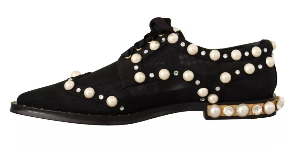 Chaussures plates formelles en dentelle noire Dolce & Gabbana avec bijoux ornés, lacets à nouer, élégantes et sophistiquées.
