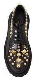Chaussures Derby en cuir noir Dolce & Gabbana, baskets de trekking ornées de détails élégants, vue de face.