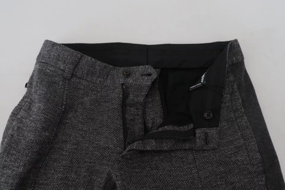 Pantalon skinny en viscose gris à chevrons de la marque Dolce & Gabbana, vue de face sur un fond neutre.