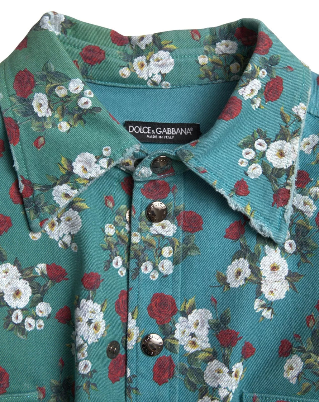 Chemise en denim Dolce & Gabbana à boutons, motif floral bleu en coton, visible sur l’image.