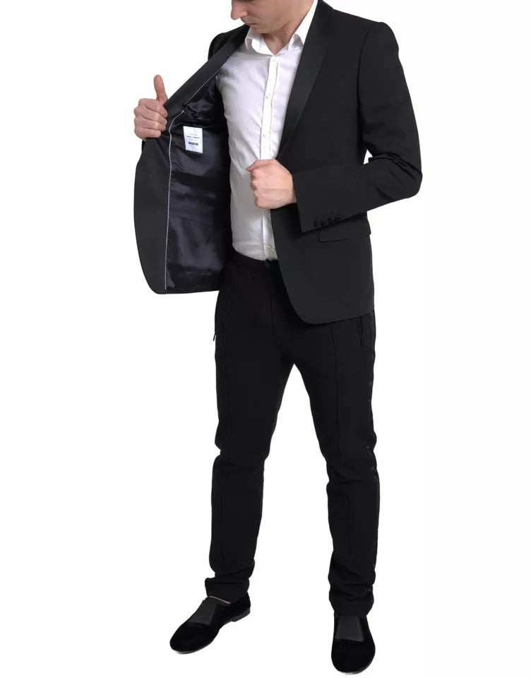 Veste noire en laine Dolce & Gabbana, blazer à un seul bouton, style Martini, porté sur un mannequin.