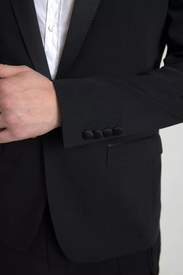 Veste blazer Dolce & Gabbana en laine noire à un bouton, coupe classique, détails sophistiqués, porté sur un mannequin.