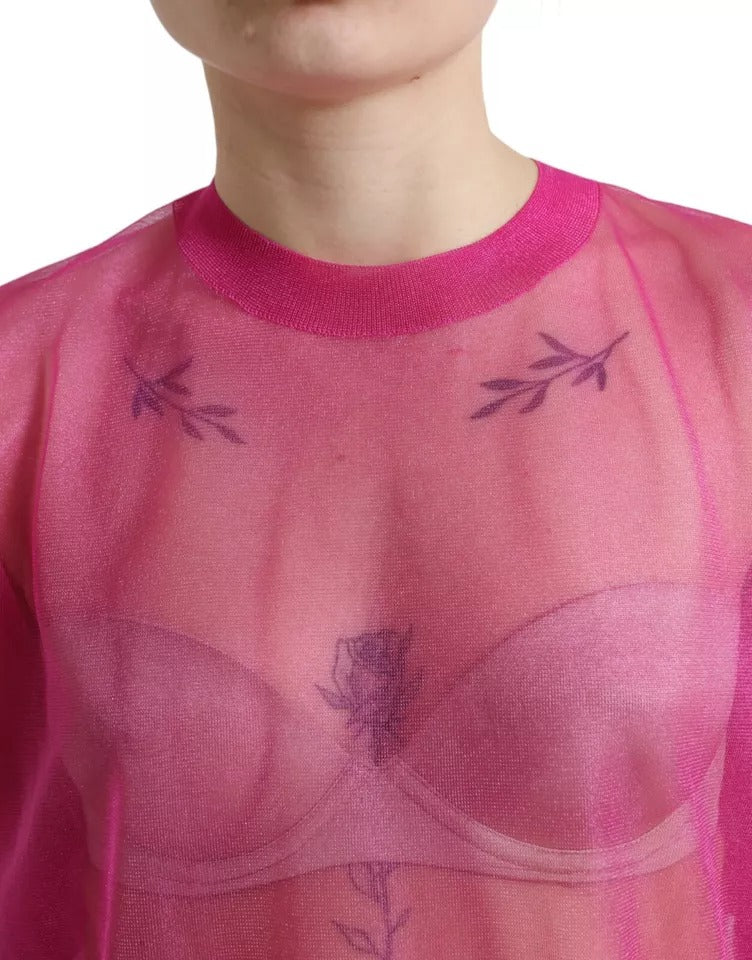Haut en voile rose à manches longues et col rond de Dolce & Gabbana, tissu léger et transparent.