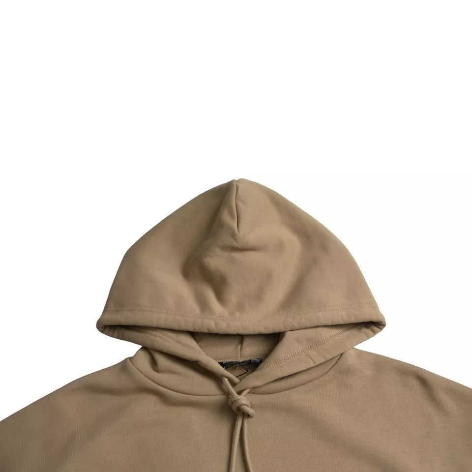 Sweat à capuche en molleton bouclette marron Balenciaga avec logo symbolique, douceur et style décontracté visible sur l'image.