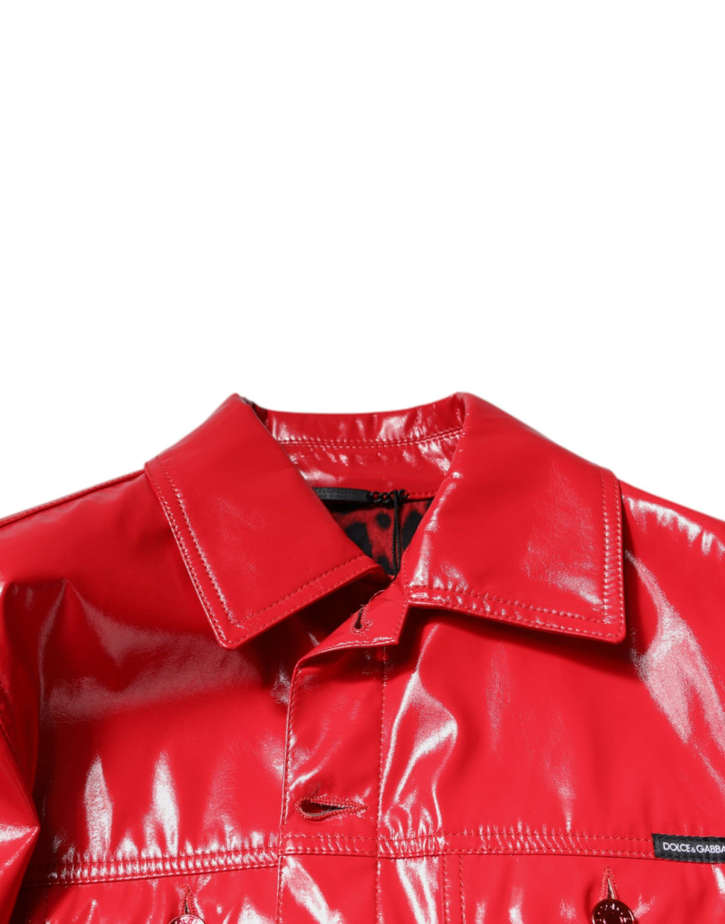 Veste en polyester rouge avec col et boutons de Dolce & Gabbana, design élégant et moderne, visible sur l’image.