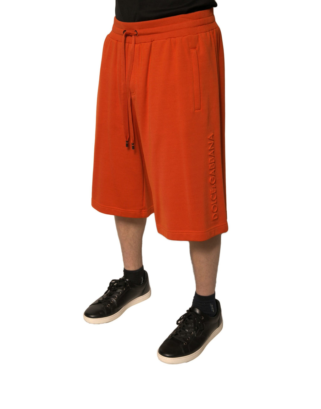 Shorts bermuda pour hommes Dolce & Gabbana en coton mélangé orange, détail visible sur l'image.