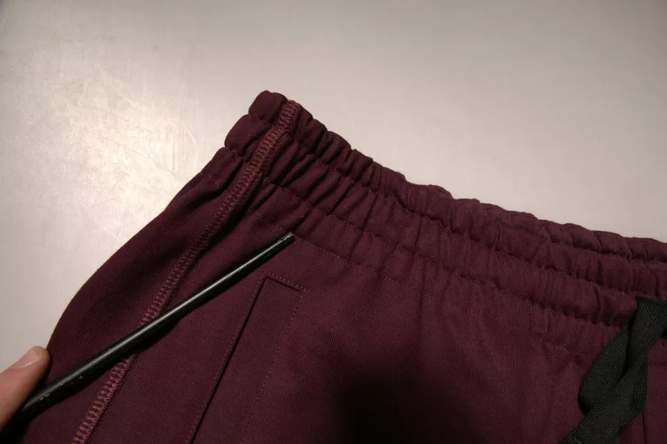 Shorts bermuda en coton marron foncé de Dolce & Gabbana, taille mi-haute, style décontracté et élégant.