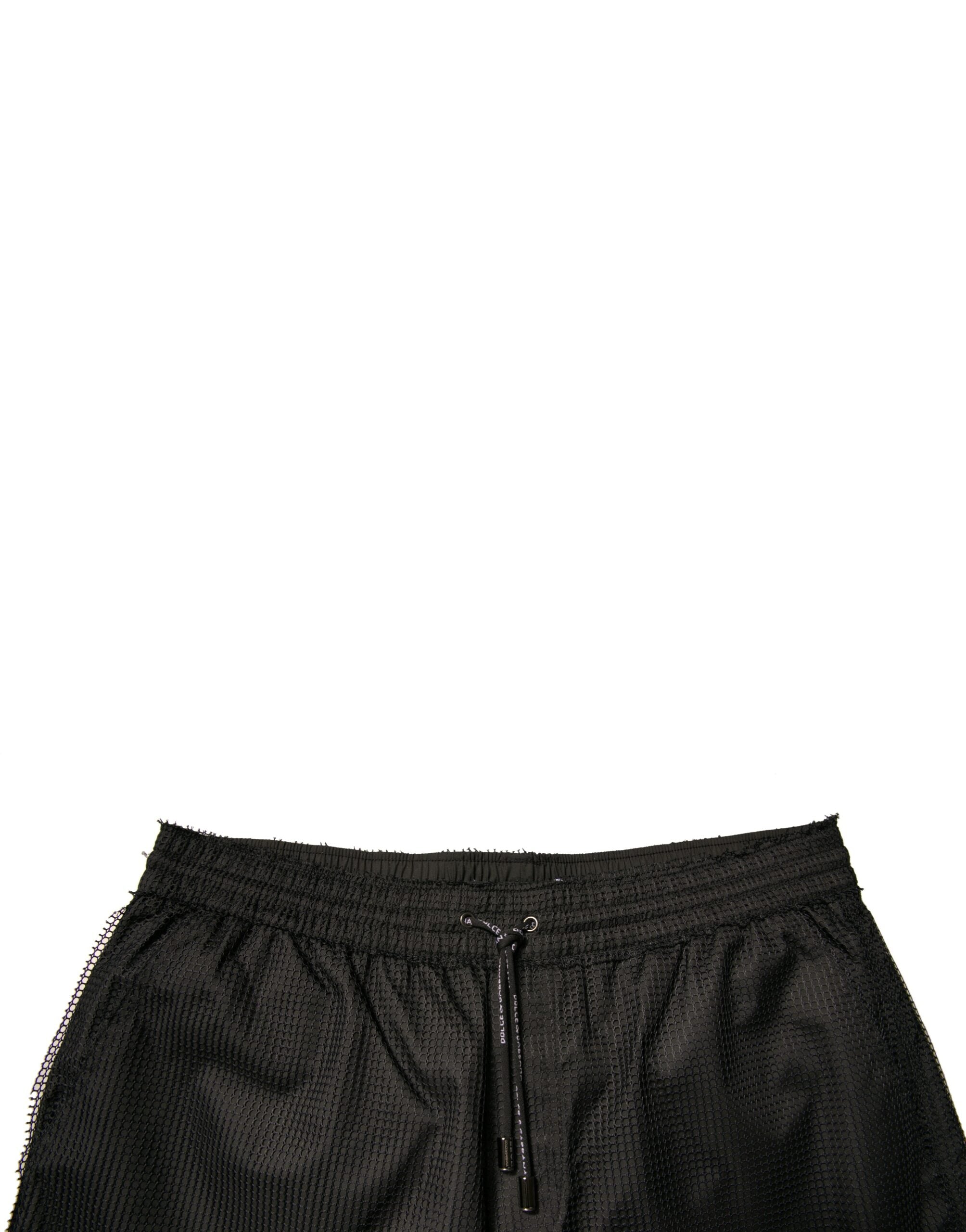 Shorts Dolce & Gabbana en polyester noir, taille mi-hauteur, style jersey, pour un look élégant et décontracté.