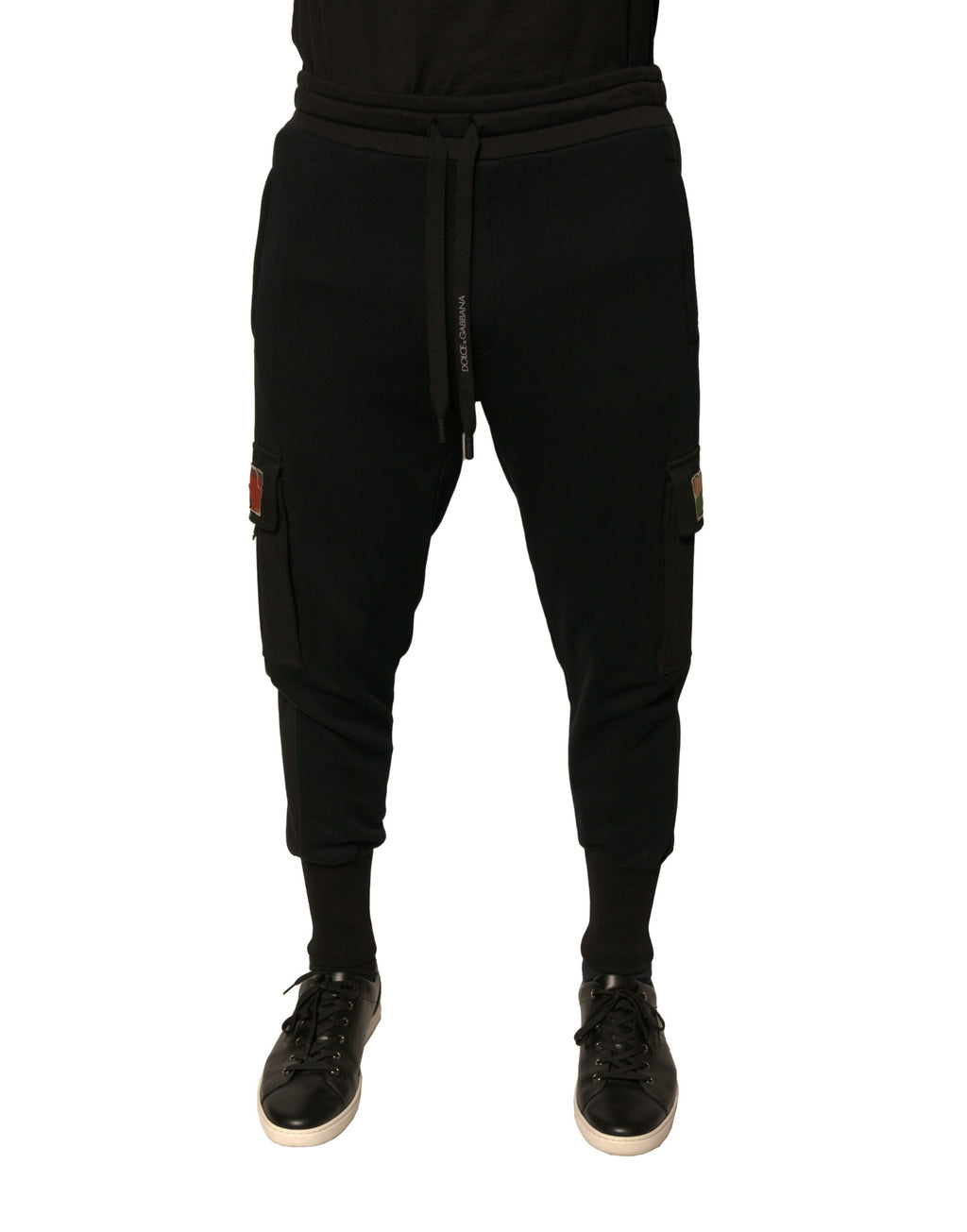 Pantalon jogging cargo en coton noir de Dolce & Gabbana, style décontracté avec poches latérales et taille élastique.