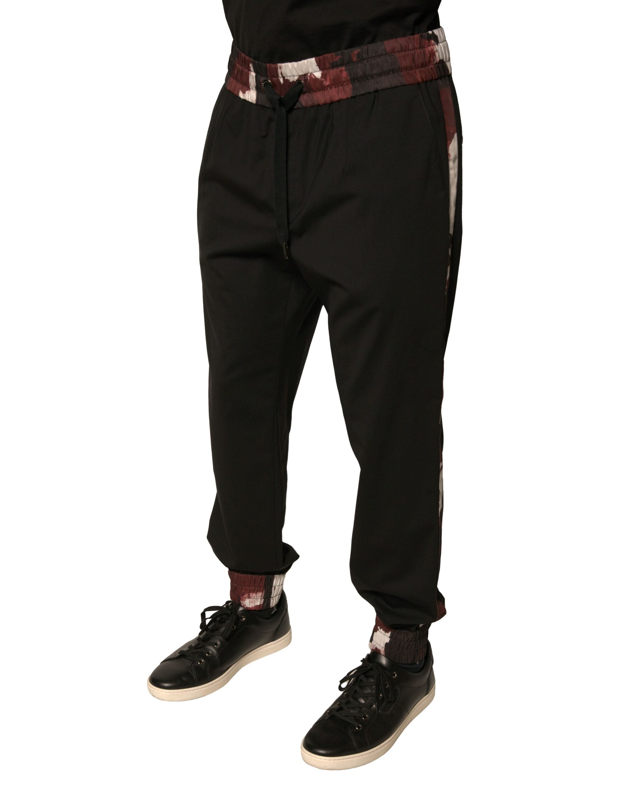 Pantalon jogging Dolce & Gabbana en laine noire camouflage, style décontracté avec poches latérales et taille élastique.