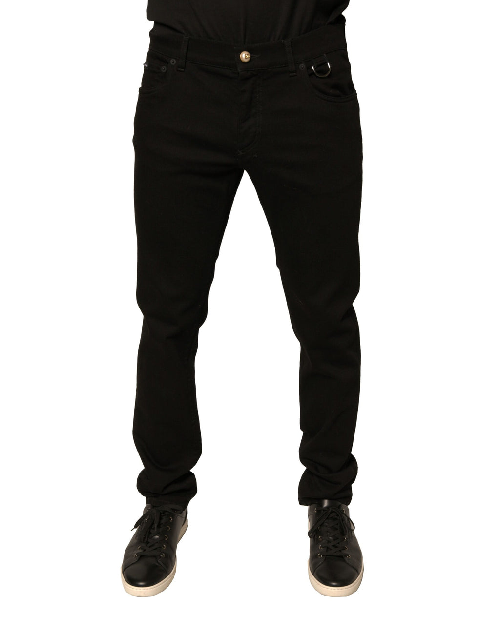 Jeans skinny en coton stretch noir Dolce & Gabbana avec logo, visible en détail sur fond neutre.