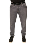 Jean skinny en coton stretch gris avec logo Dolce & Gabbana, denim, style moderne et ajusté, visible sur le produit.