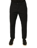 Jeans skinny en denim noir Dolce & Gabbana avec logo en coton stretch, ajustés et modernes, visibles en détail.