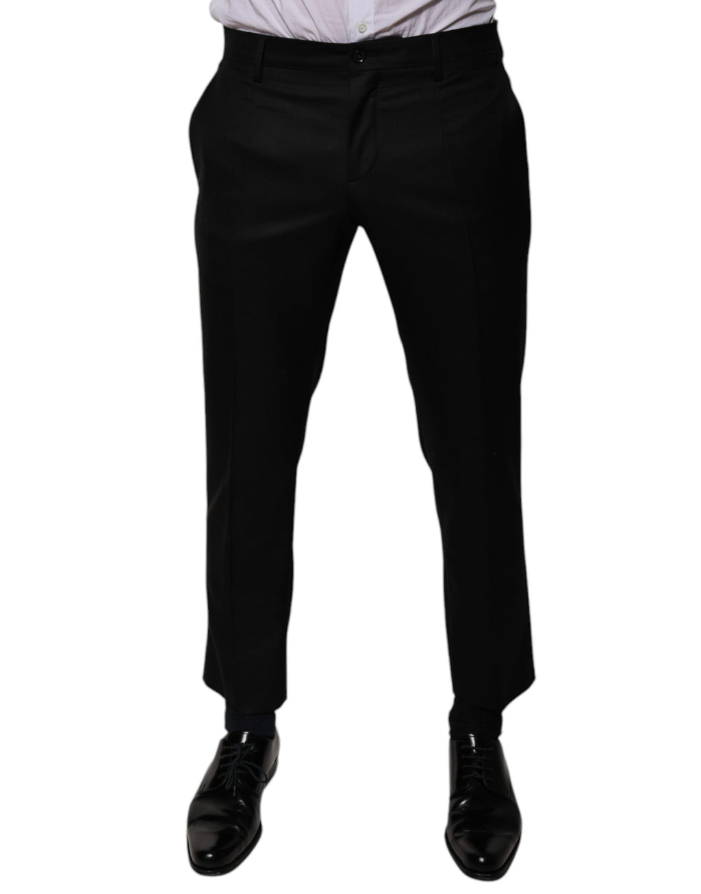 Pantalon de costume noir en laine Dolce & Gabbana, coupe tapered, pour homme, détail élégant et tissu de qualité visible.