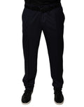 Pantalon de costume homme Dolce & Gabbana bleu foncé, coupe tapered, élégant et ajusté, en tissu formel avec détails soignés.
