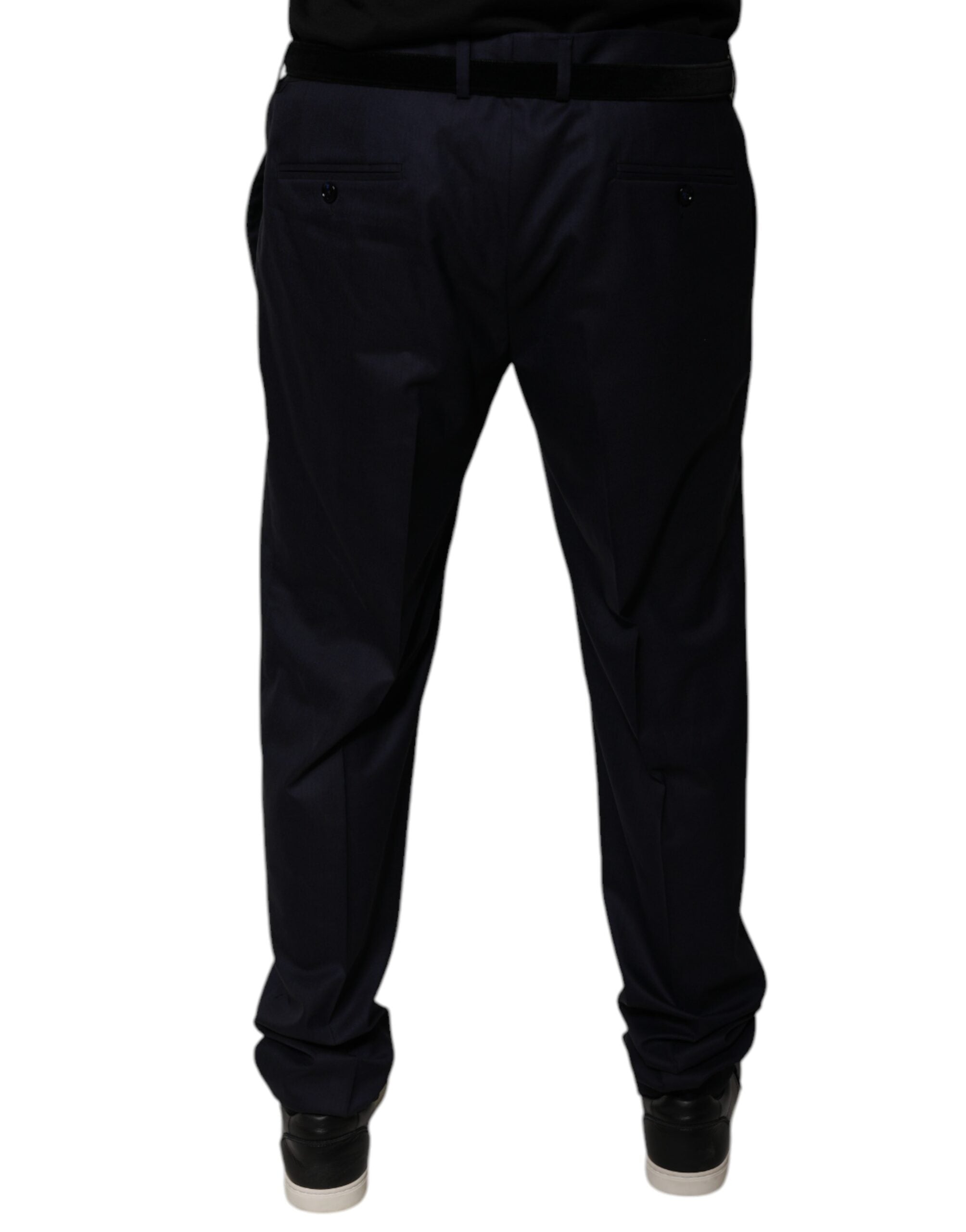 Pantalon de costume formel bleu foncé Dolce & Gabbana, coupe tapered, en tissu élégant, visible sur un fond neutre.