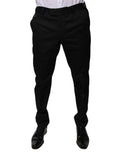 Pantalons de costume noirs en coton Dolce & Gabbana, coupe tapered, pour homme, avec finition élégante et tissu de qualité.
