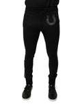 Pantalons slim en laine noire Dolce & Gabbana avec embellissements de fer à cheval, aspect élégant et ajusté.