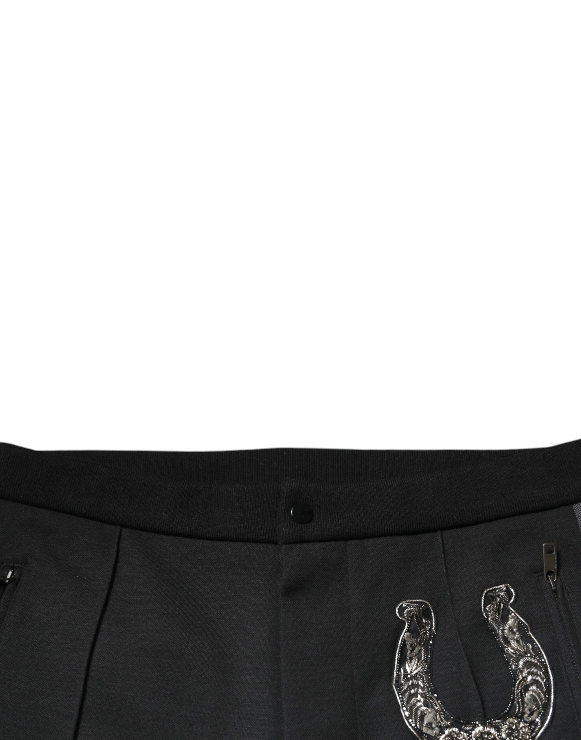 Pantalon slim en laine noir Dolce & Gabbana avec embellissements en forme de fer à cheval, ajusté et élégant.