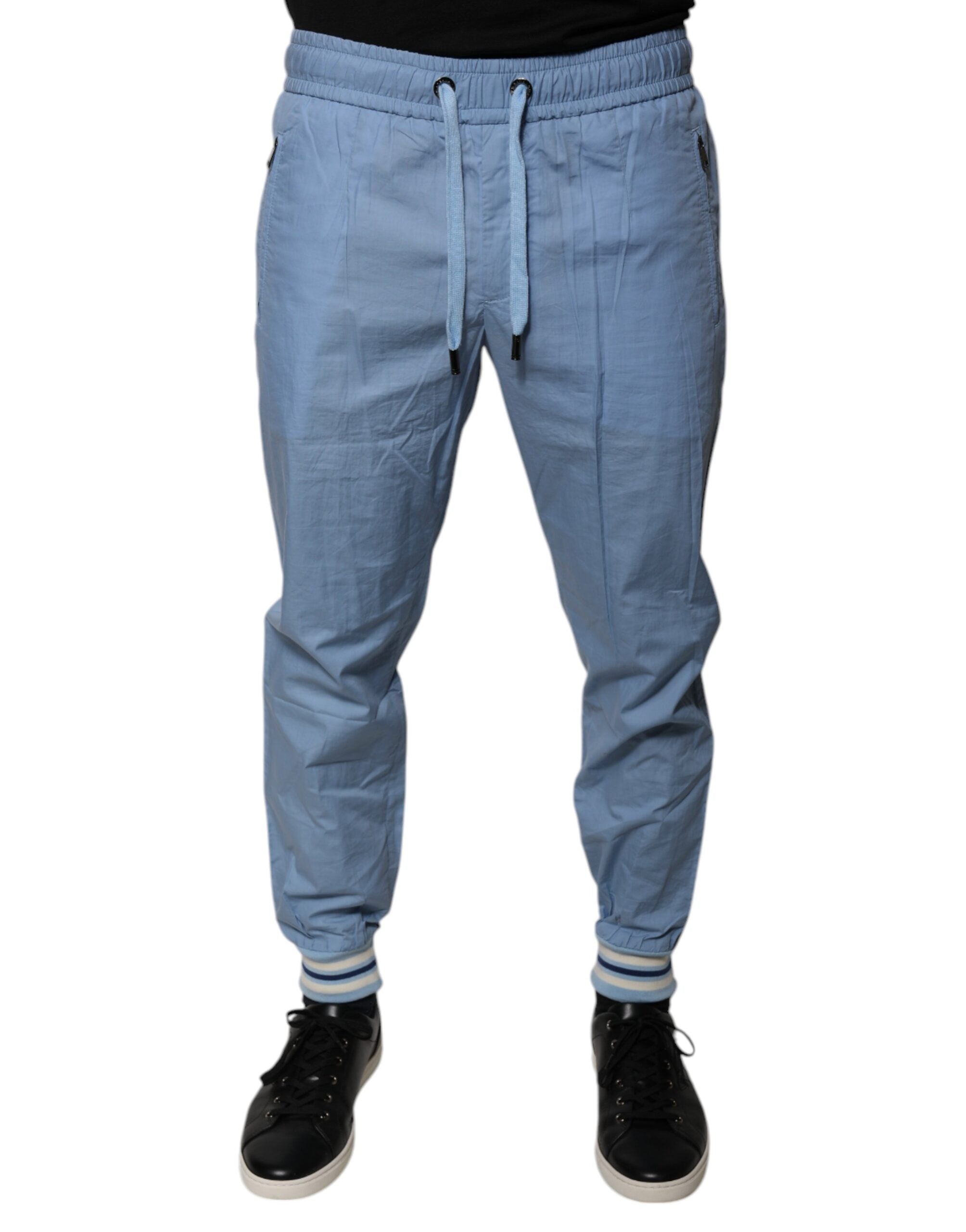 Pantalons de jogging en coton bleu Dolce & Gabbana, style décontracté avec logo de la marque visible.