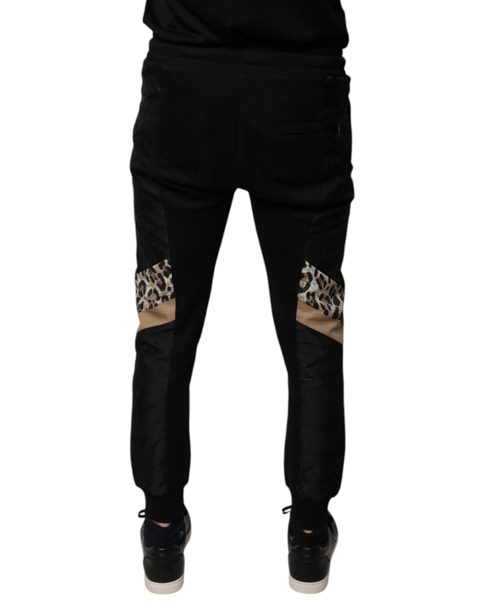 Pantalons jogger slim noir à motif léopard de Dolce & Gabbana, coupe ajustée et style tendance.