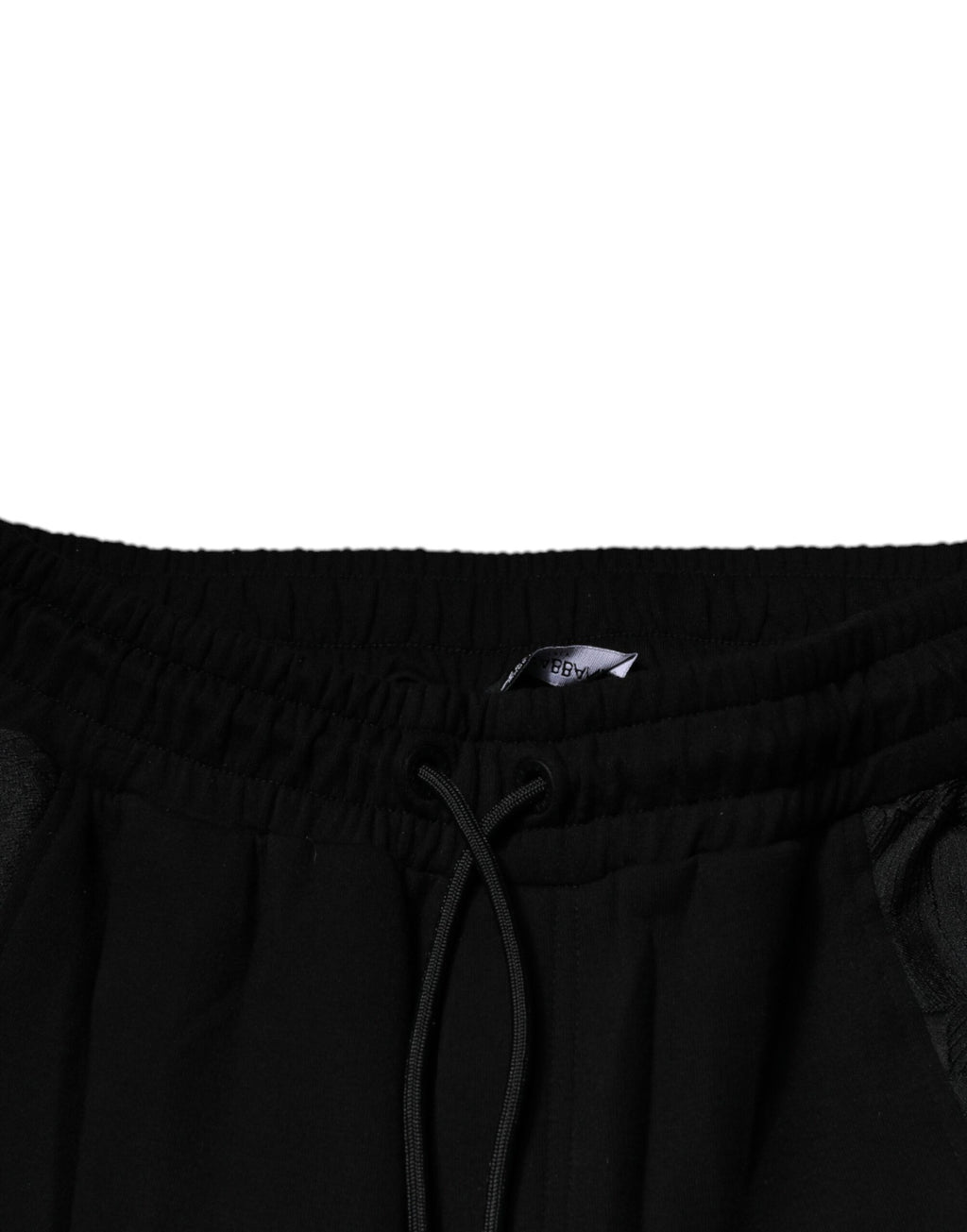 Pantalons joggers slim fit en leopard noir de Dolce & Gabbana, en tissu confortable, vue de face.