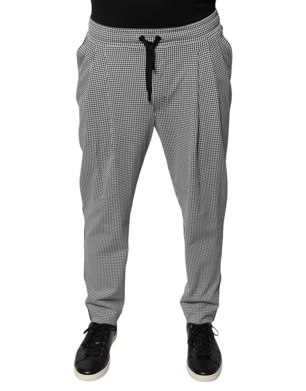 Pantalon skinny Dolce & Gabbana à motif pied-de-poule noir et blanc, coupe ajustée et élégante.
