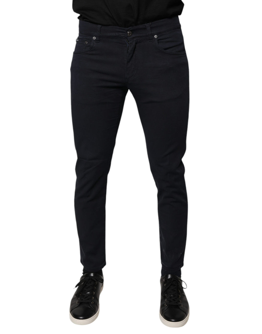 Jeans skinny en denim coton stretch noir Dolce & Gabbana avec logo, visibles avec détails de la coupe ajustée et style moderne.
