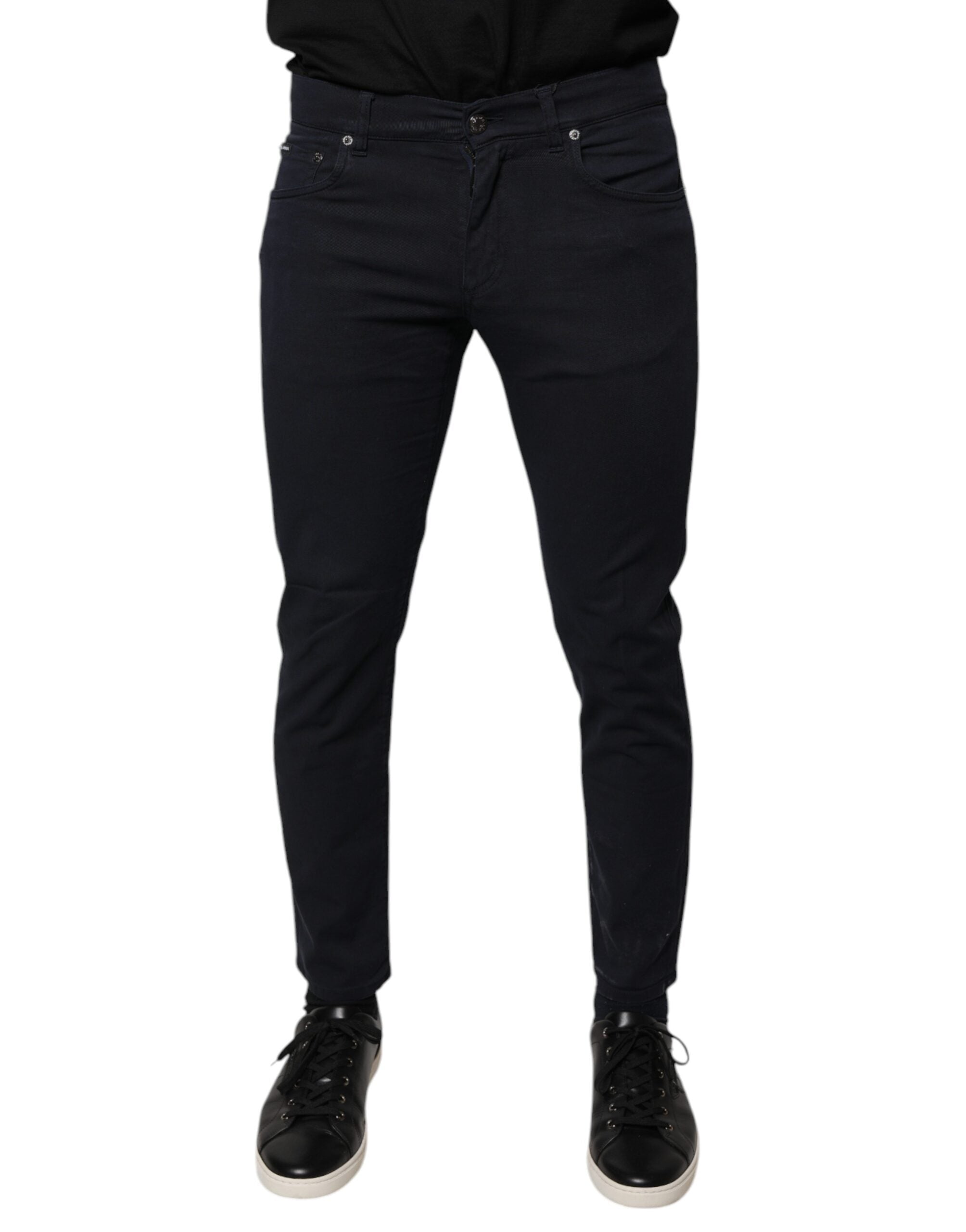Jeans skinny en denim coton stretch noir Dolce & Gabbana avec logo, visibles avec détails de la coupe ajustée et style moderne.