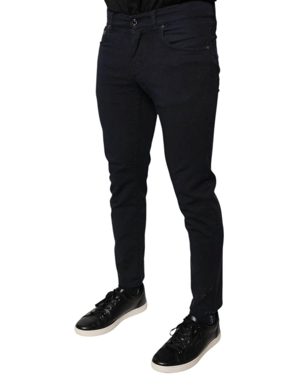 Jeans skinny en denim noir Dolce & Gabbana avec logo en coton stretch, visibles avec détails de la coupe ajustée.