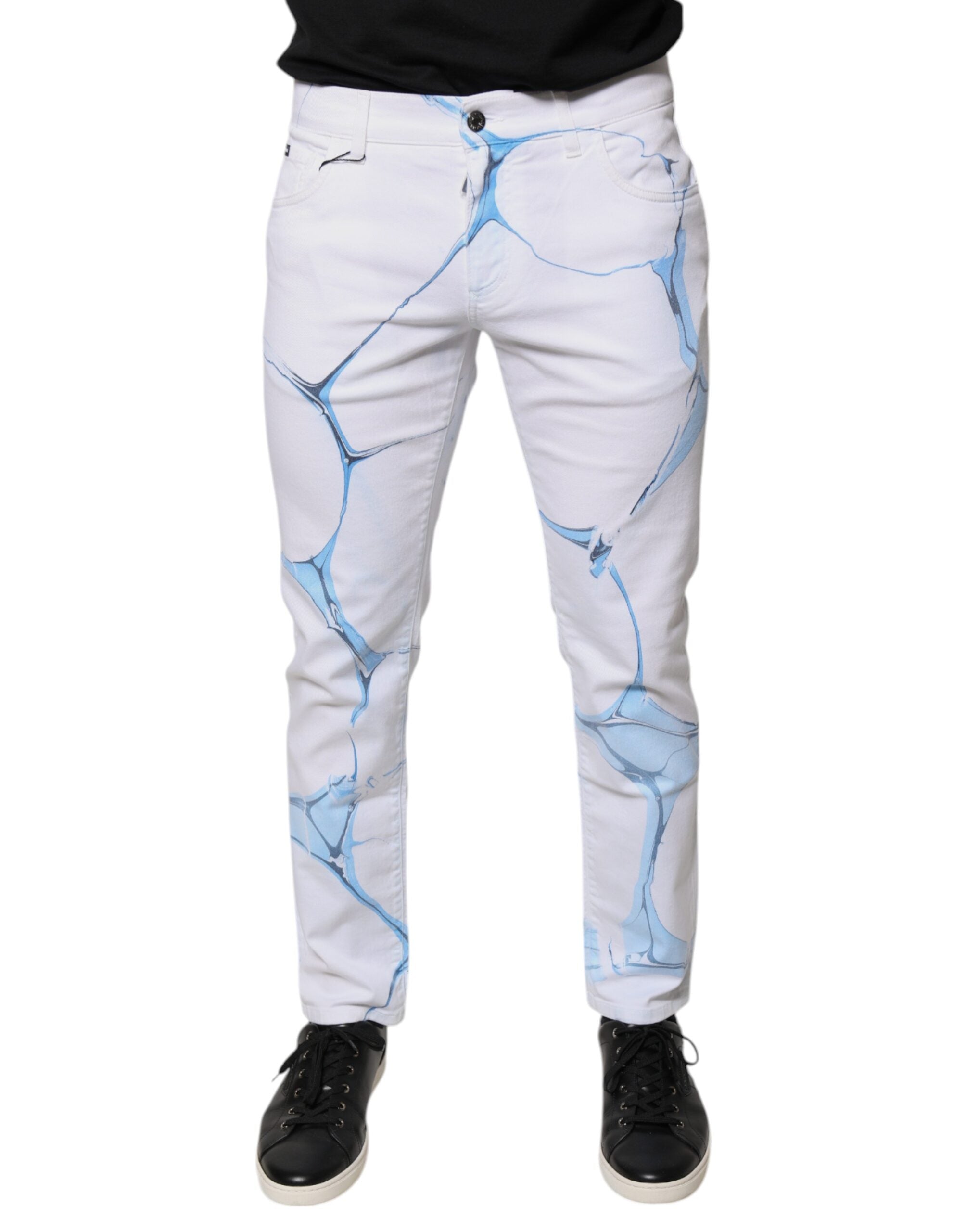 Jeans skinny en coton stretch blanc et bleu de Dolce & Gabbana, coupe ajustée et détails denim visibles.
