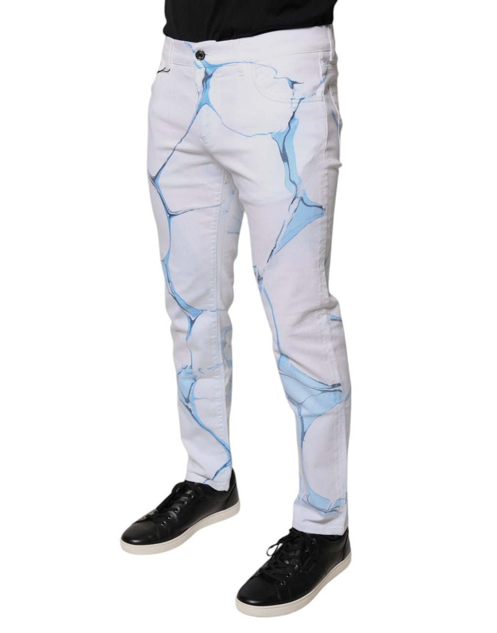 Jeans skinny en denim coton stretch blanc et bleu de Dolce & Gabbana, vue détaillée avec coutures et bouton.