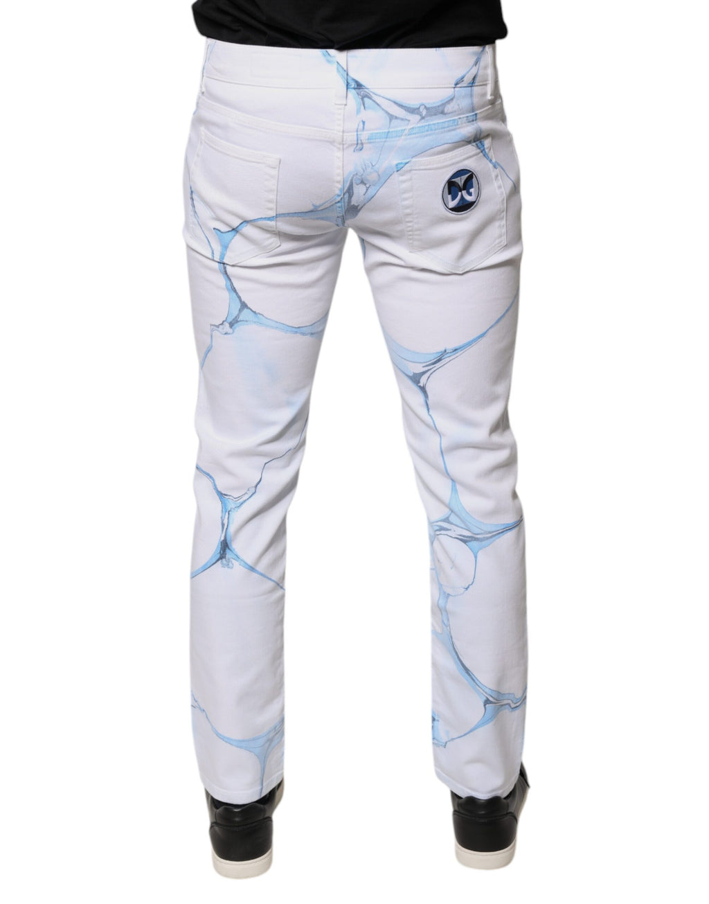 Jeans slim en coton stretch blanc et bleu de Dolce & Gabbana, denim skinny pour femmes, visible avec détails de couture.