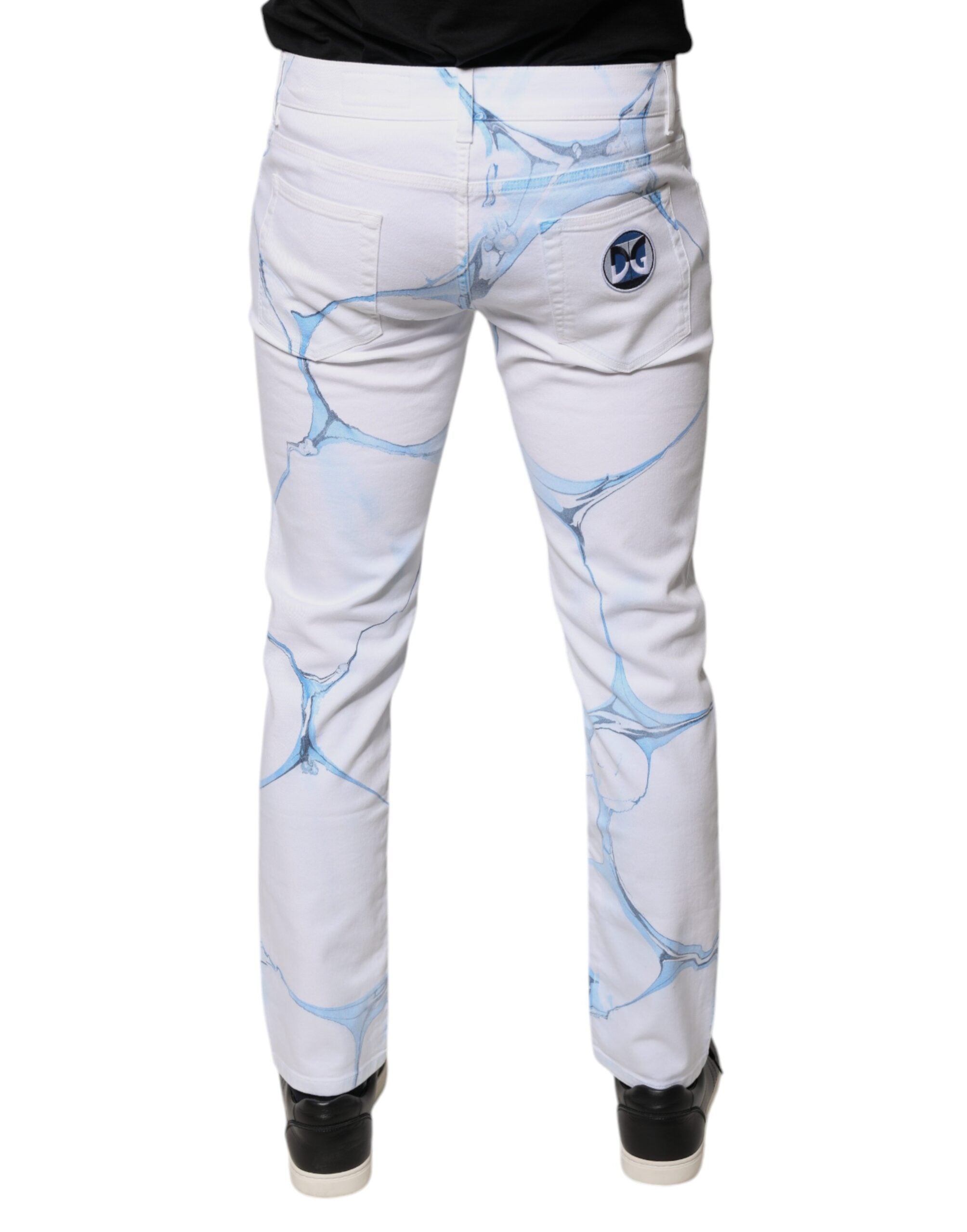 Jeans slim en coton stretch blanc et bleu de Dolce & Gabbana, denim skinny pour femmes, visible avec détails de couture.