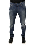 Jeans skinny en coton bleu Dolce & Gabbana avec logo DG en couronne, détail de la marque sur la poche arrière.