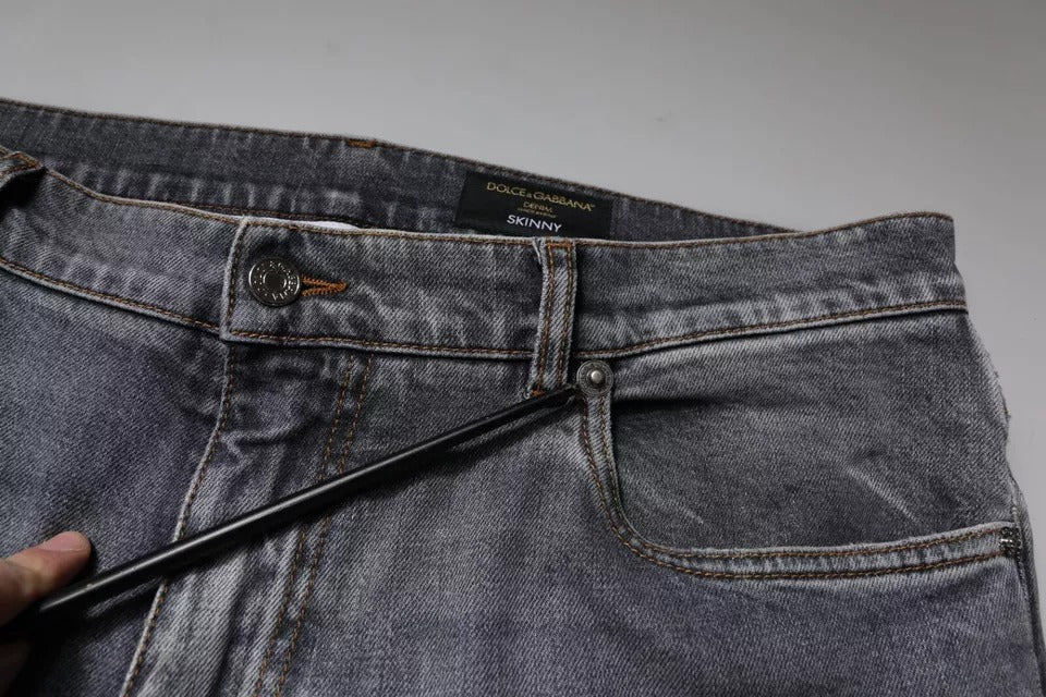 Jean skinny en denim gris à logo en coton stretch de Dolce & Gabbana, coupe ajustée et détails de marque visibles.