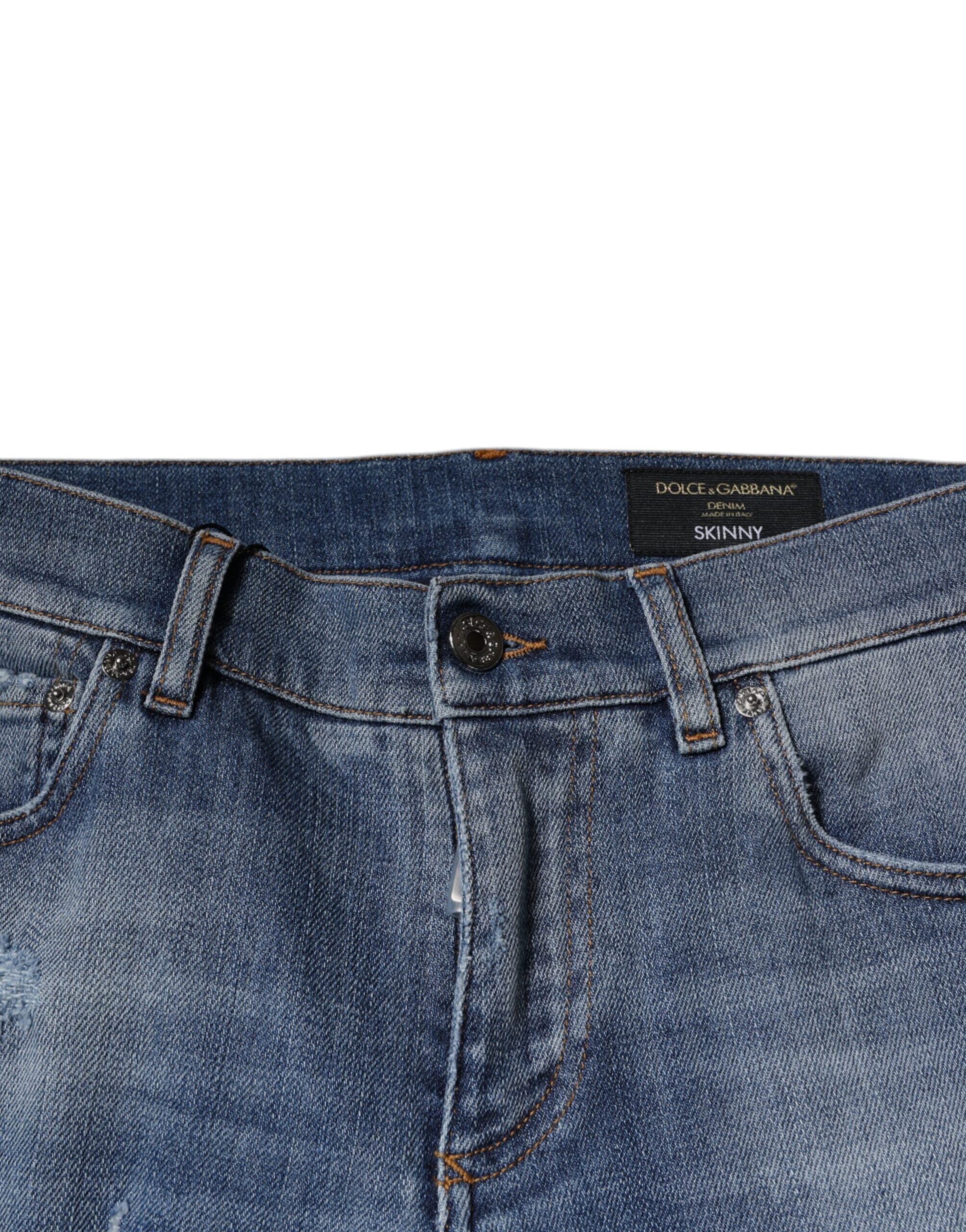 Jeans skinny en denim coton déchiré bleu Dolce & Gabbana, coupe stretch, détails usés et finition tendance.