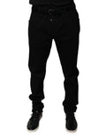 Jeans skinny en denim noir Dolce & Gabbana avec logo en coton extensible, coupe ajustée et détails modernes.