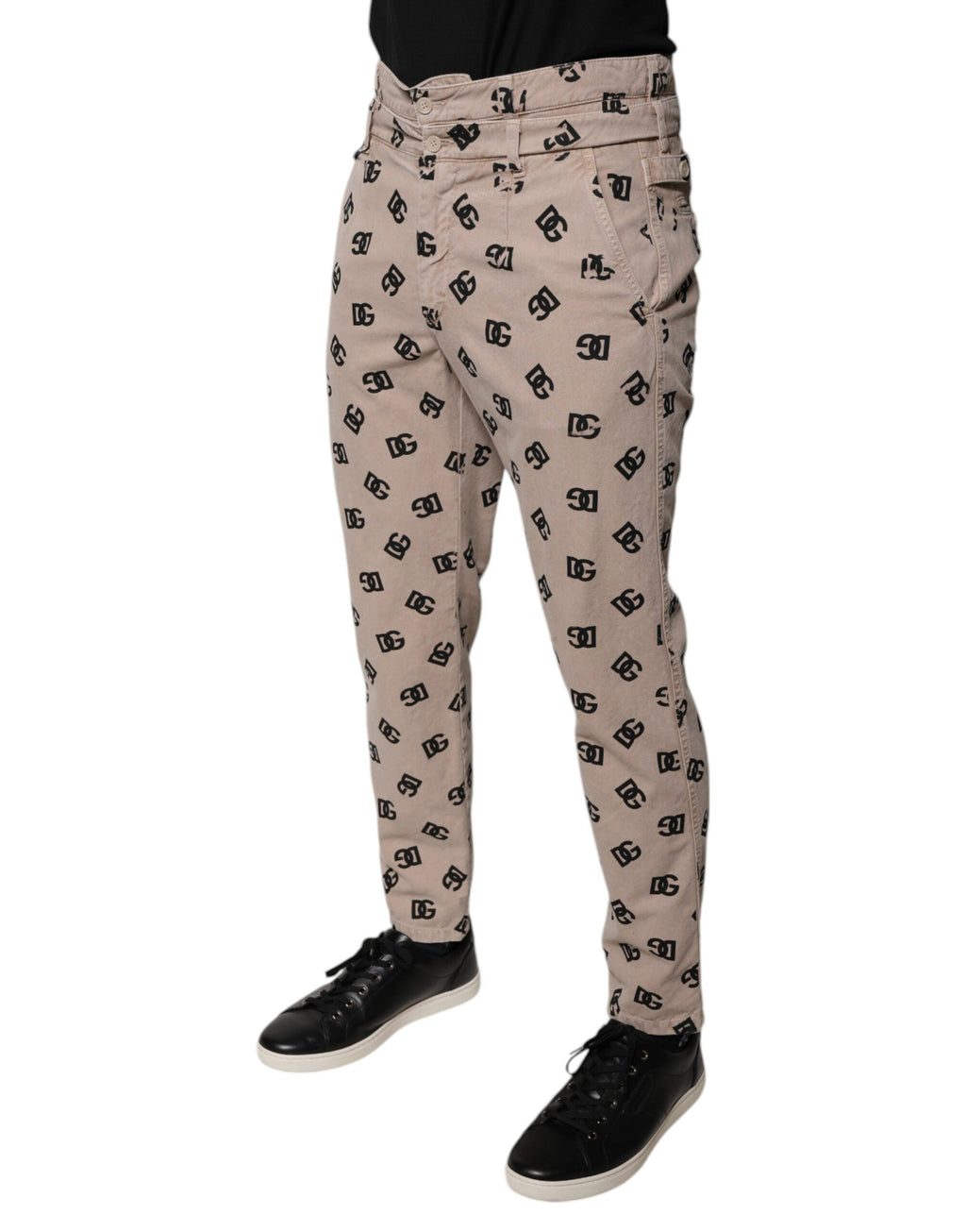 Jeans skinny en denim coton beige avec logo Dolce & Gabbana, style ajusté et moderne, visible sur l'image.