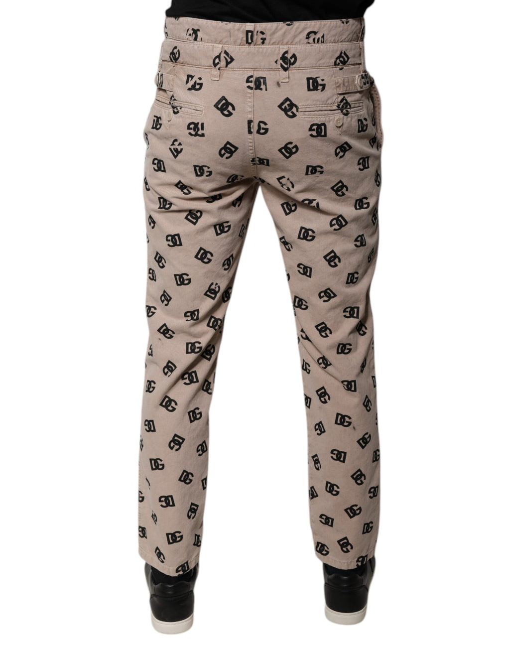 Jeans skinny en denim coton beige Dolce & Gabbana avec logo, visible en détail sur l'image.